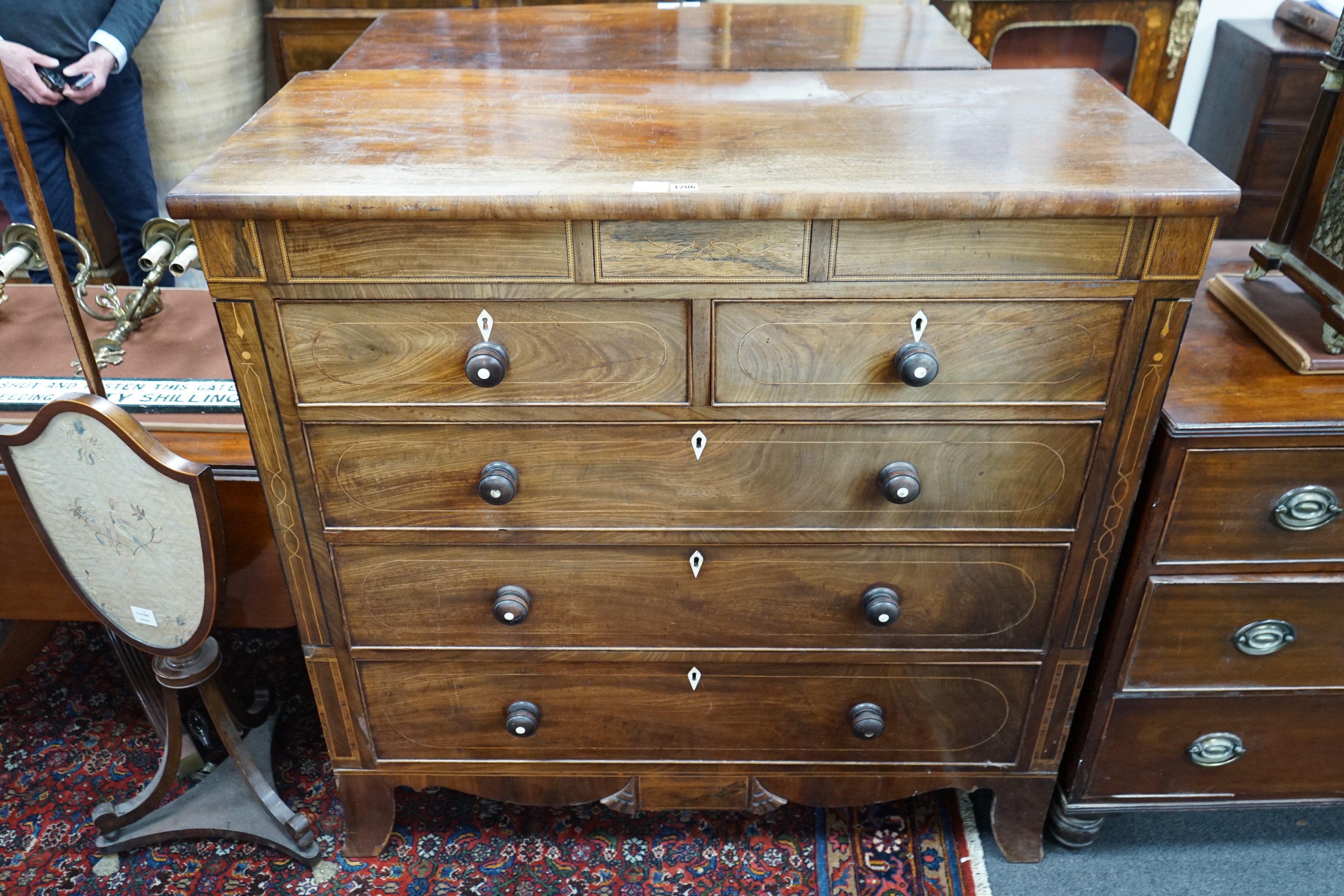 A George IV inlaid mahogany chest of eight drawers, width 122cm, depth 53cm, height 120cm